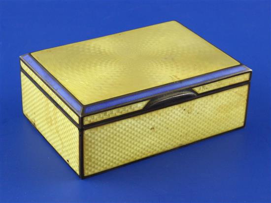 A 1920s continental silver and yellow guilloche enamel mounted rectangular cigarette box, 4.5in.